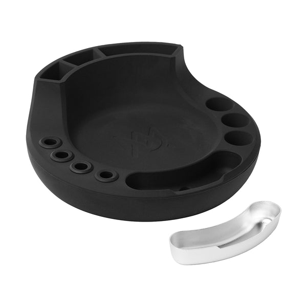 A black, contoured tool holder with multiple circular and rectangular slots, accompanied by a small, silver curved tray, placed on a plain white background.